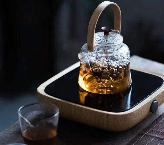 Tea leaves being prepared for boiling