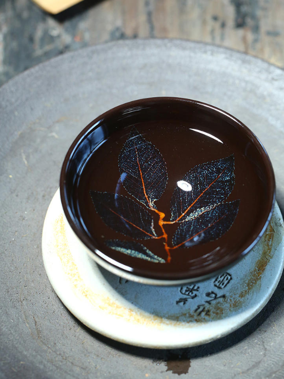 What type of host cup complements a purple clay teapot?-10