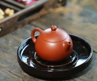 What are the most popular Yixing clay teapot shapes among women? What teas pair best with them?