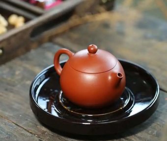 What are the most popular Yixing clay teapot shapes among women? What teas pair best with them?